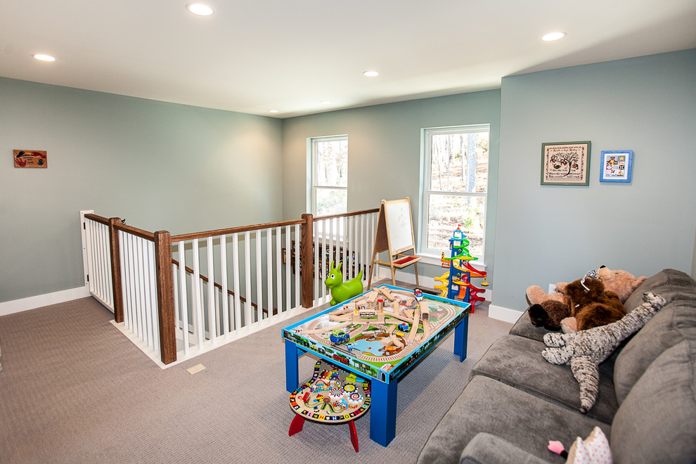 Immagine di una cameretta per bambini da 1 a 3 anni stile americano di medie dimensioni con pareti grigie e moquette