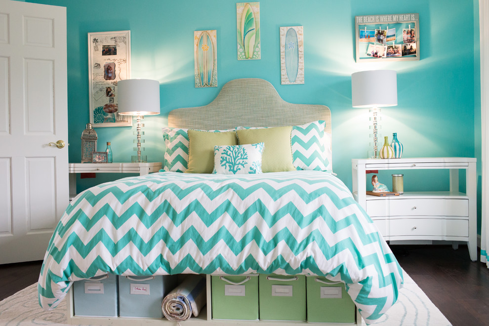 Photo of a nautical teen’s room for girls in Baltimore with blue walls and dark hardwood flooring.