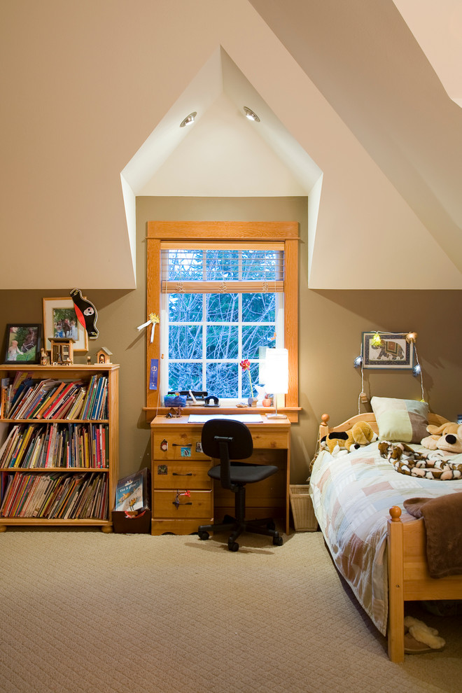 This is an example of a traditional gender neutral kids' bedroom in Seattle with beige walls and carpet.