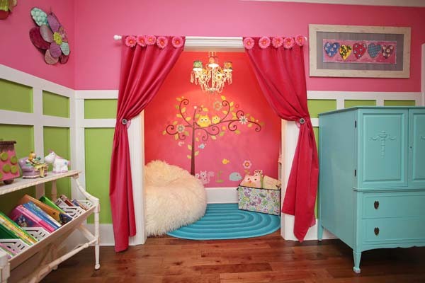 Inspiration for a timeless girl medium tone wood floor kids' room remodel in Charlotte with pink walls