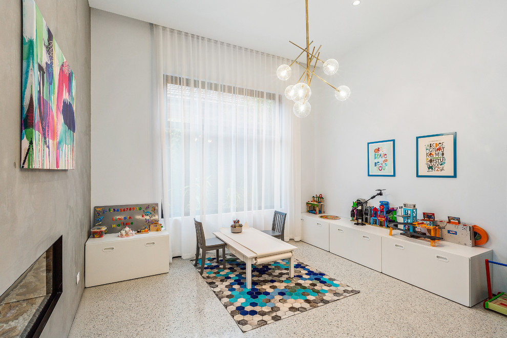 Exempel på ett mellanstort modernt könsneutralt småbarnsrum kombinerat med lekrum, med vita väggar, betonggolv och grått golv