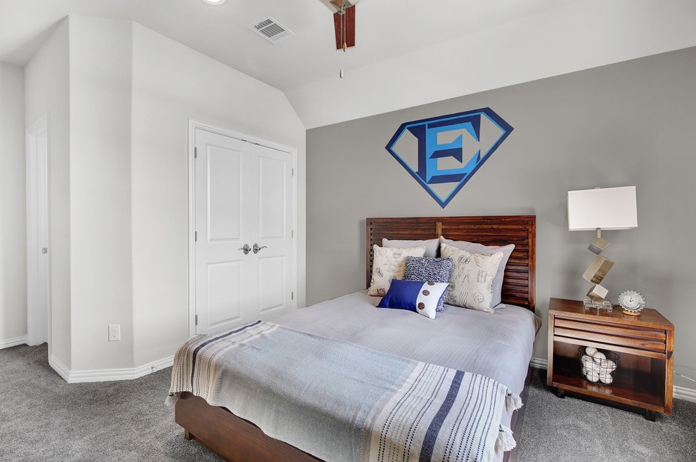 Large trendy boy carpeted and gray floor kids' room photo in Dallas with gray walls