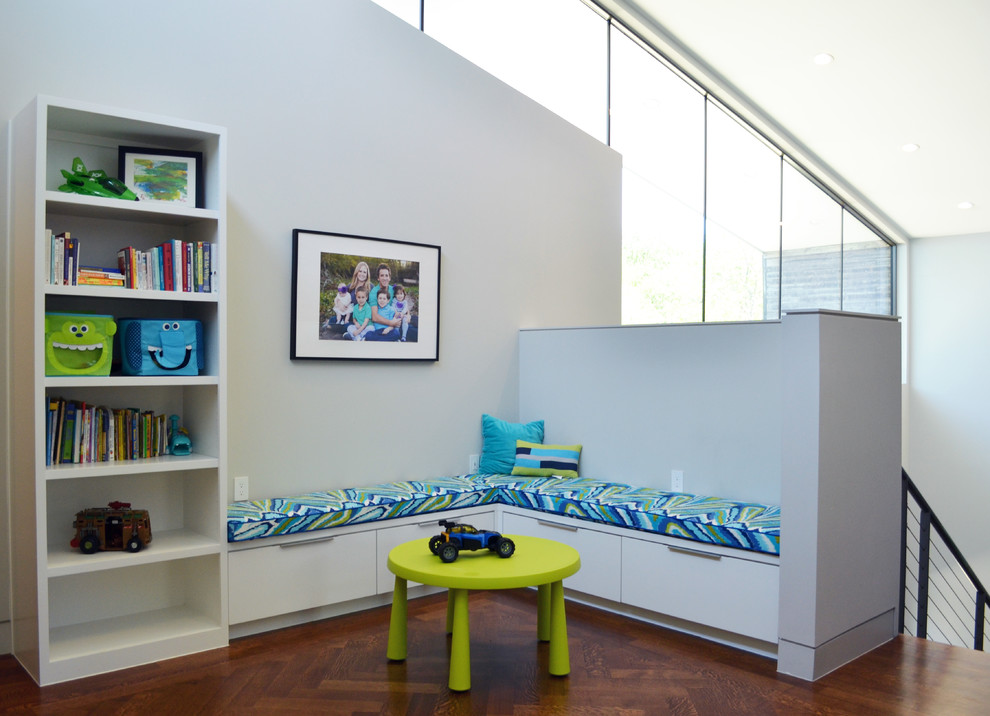 Playroom - contemporary gender-neutral dark wood floor playroom idea in Dallas with white walls