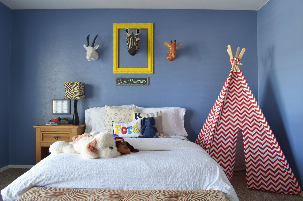 Classic children’s room for boys in Dallas with blue walls and carpet.