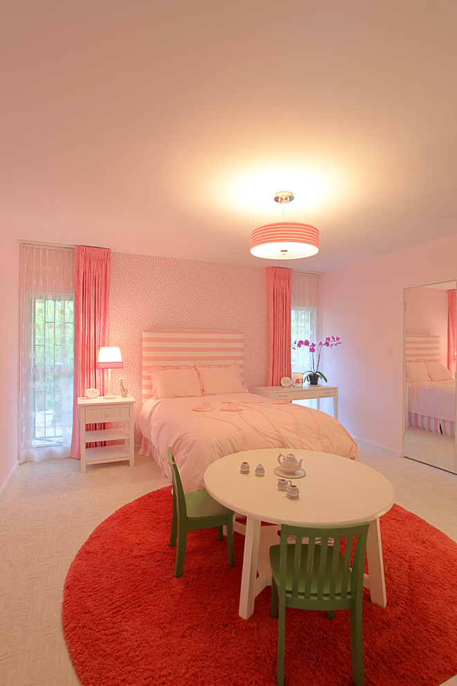 Inspiration for a medium sized modern children’s room for girls in Los Angeles with pink walls and carpet.