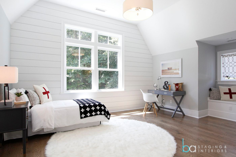 Example of a mid-sized trendy gender-neutral medium tone wood floor, brown floor and shiplap wall kids' room design in New York with white walls