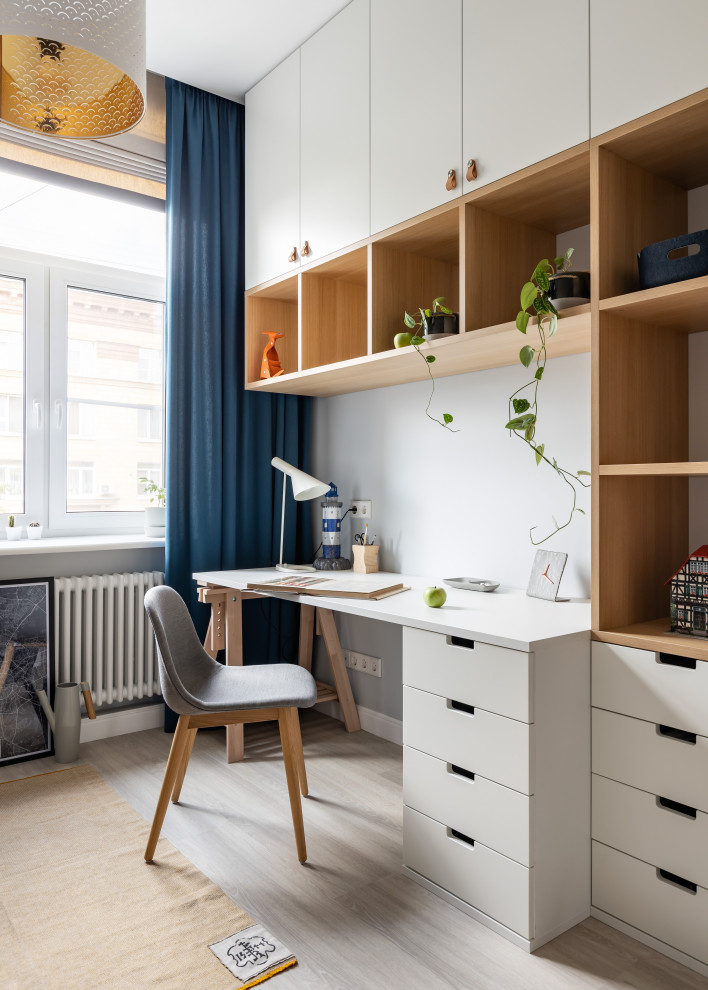 Inspiration for a scandinavian gender neutral kids' bedroom in Saint Petersburg with white walls, grey floors and light hardwood flooring.