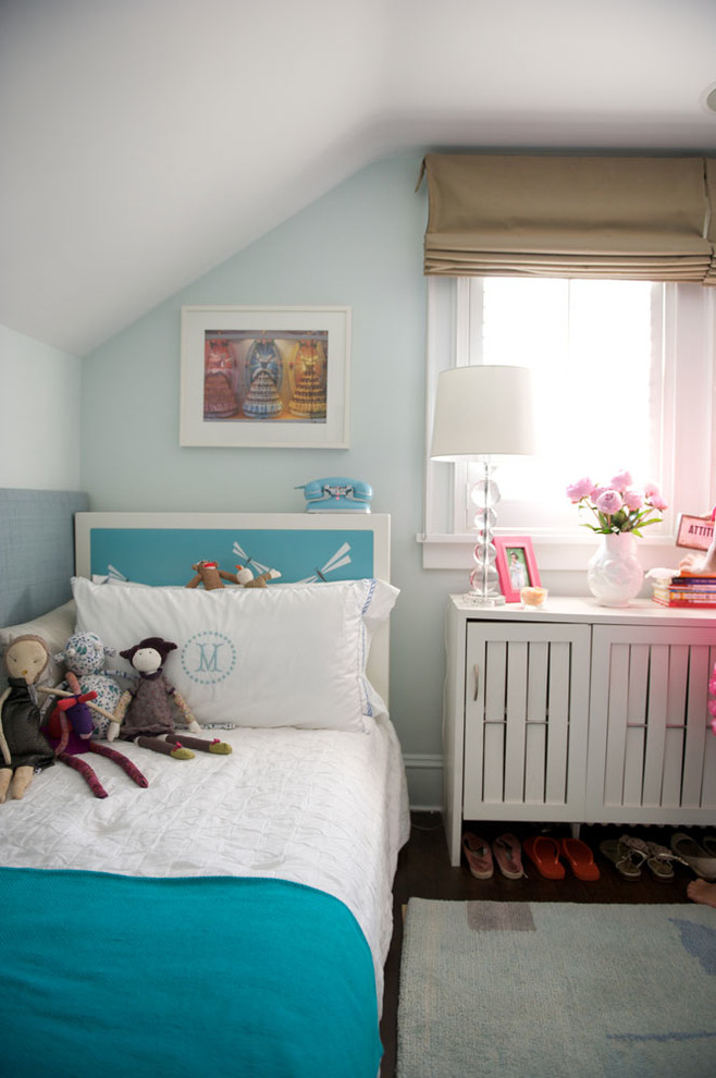Photo of a medium sized contemporary gender neutral kids' bedroom in Chicago with white walls and dark hardwood flooring.