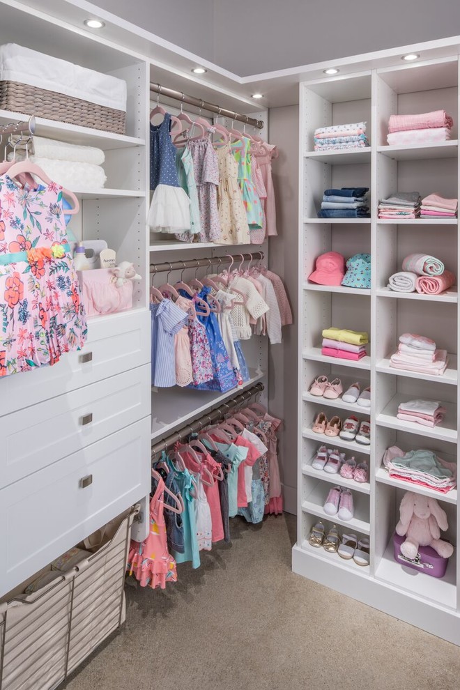 Design ideas for a traditional toddler’s room for girls in Nashville with grey walls, carpet and beige floors.