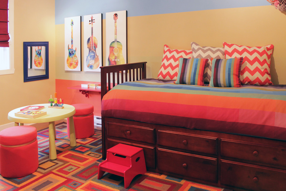 Inspiration for a mid-sized contemporary boy carpeted kids' room remodel in Montreal with multicolored walls