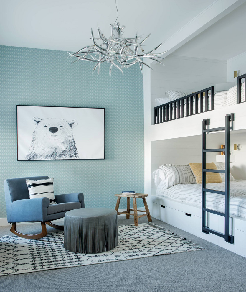 Photo of a rustic gender neutral children’s room in Other with blue walls, carpet, grey floors, wallpapered walls and feature lighting.