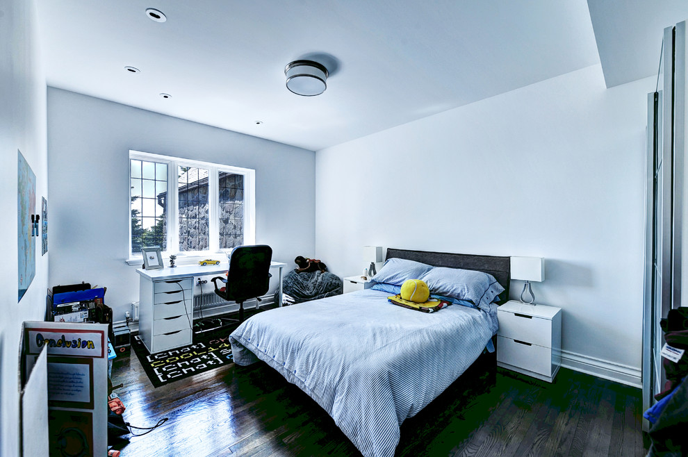 Large contemporary teen’s room for boys in Montreal with white walls and dark hardwood flooring.