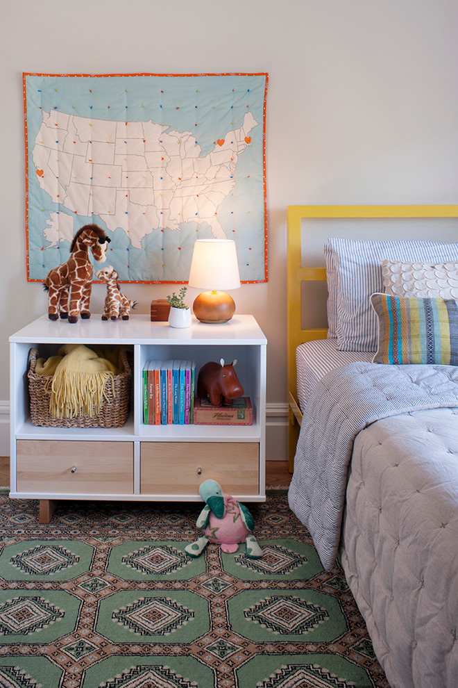 Inspiration for a mid-sized modern girl light wood floor kids' room remodel in San Francisco with gray walls