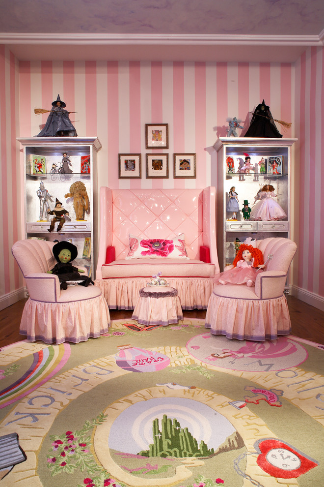 Design ideas for a medium sized eclectic children’s room for girls in New York with pink walls and medium hardwood flooring.