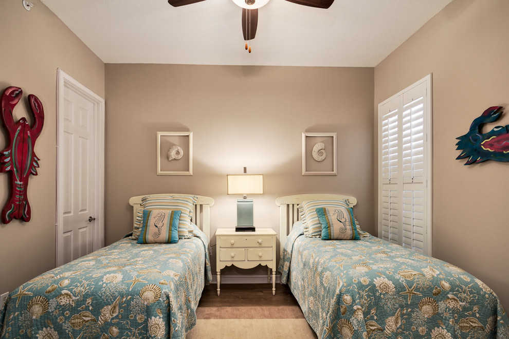 Example of a mid-sized beach style gender-neutral kids' bedroom design in Miami with beige walls