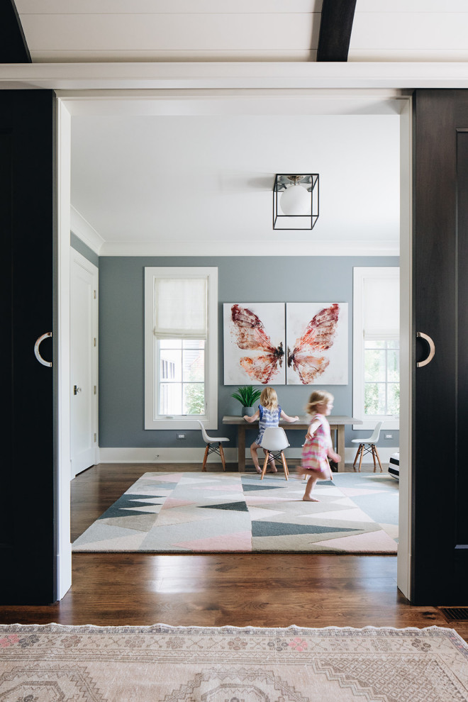 Large traditional playroom in Chicago with blue walls, dark hardwood flooring and brown floors.