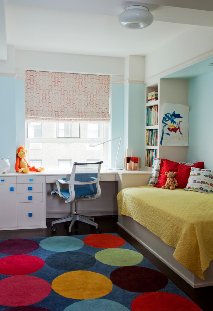 Photo of a small classic gender neutral children’s room in New York with blue walls and feature lighting.