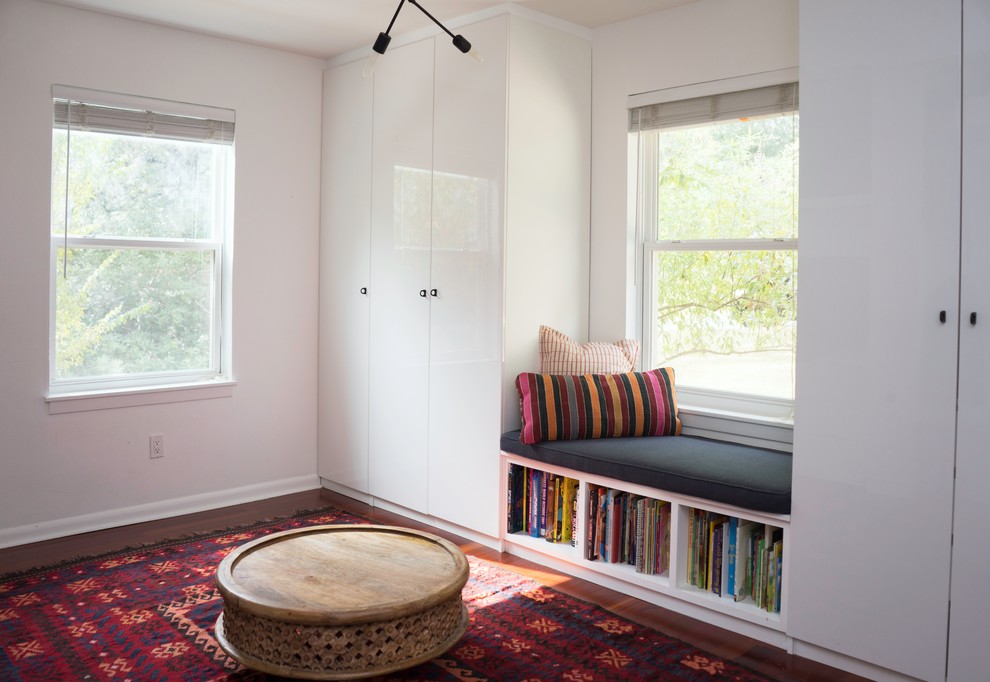 Kids' bedroom - eclectic gender-neutral dark wood floor kids' bedroom idea in Austin with white walls