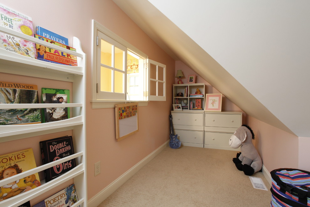 Example of a small classic girl carpeted kids' room design in Minneapolis with pink walls