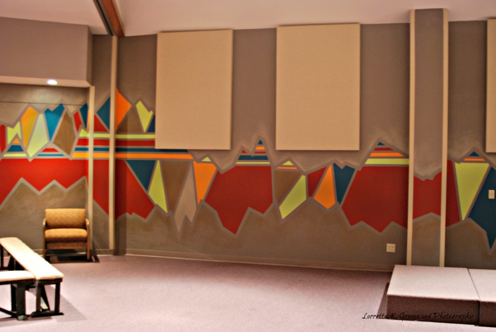 Esempio di una grande cameretta per bambini design con pareti multicolore e moquette