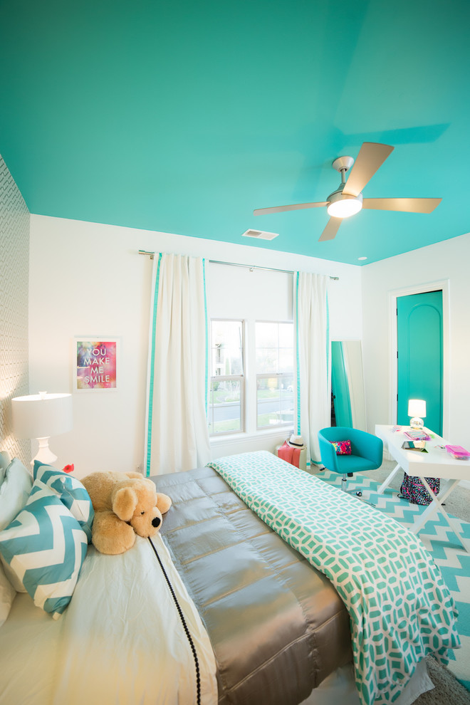 This is an example of a modern kids' bedroom for girls in Sacramento with blue walls.