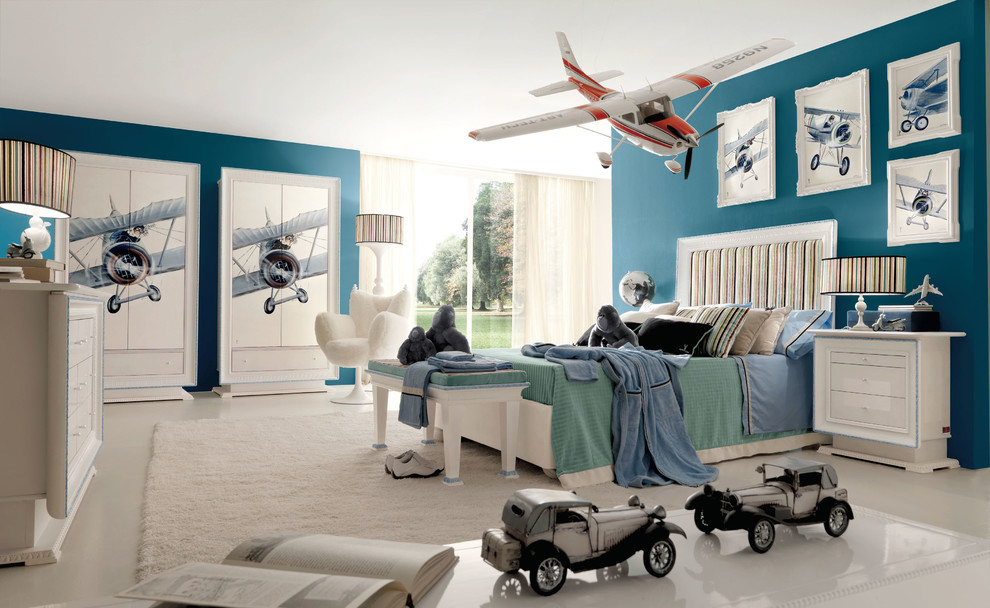 Inspiration for a modern kids' bedroom for boys in Miami with blue walls and carpet.