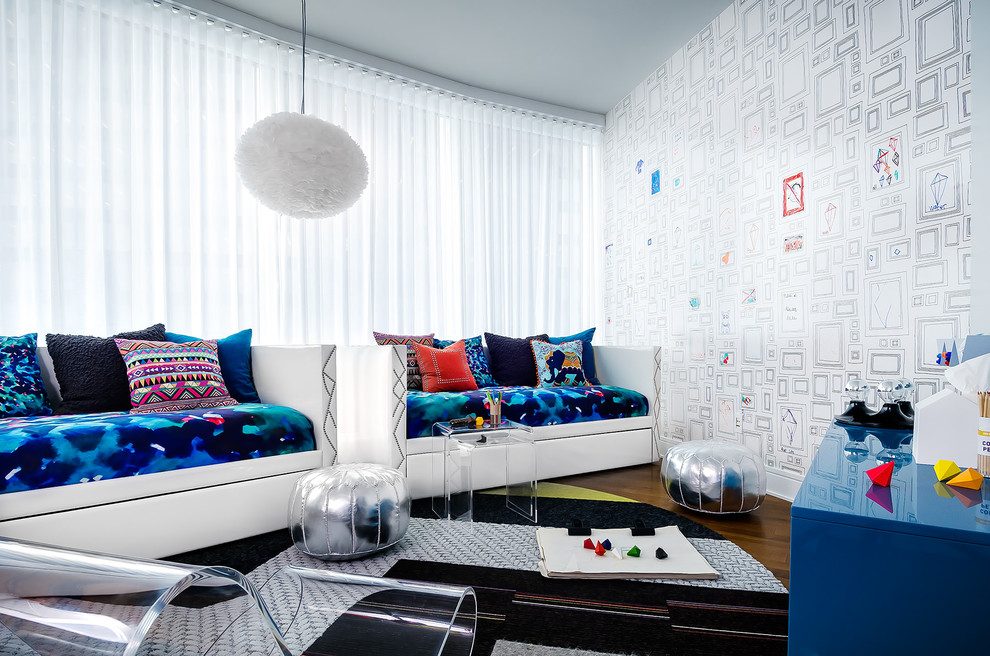 Example of a trendy gender-neutral kids' room design in Chicago with white walls