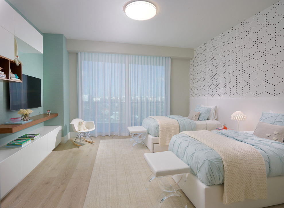Example of a large trendy gender-neutral light wood floor and beige floor kids' bedroom design in Miami with blue walls