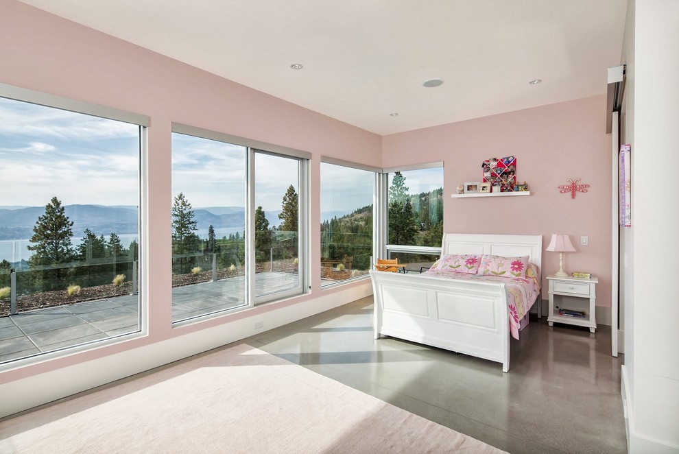Mid-sized elegant girl concrete floor kids' room photo in Vancouver with pink walls