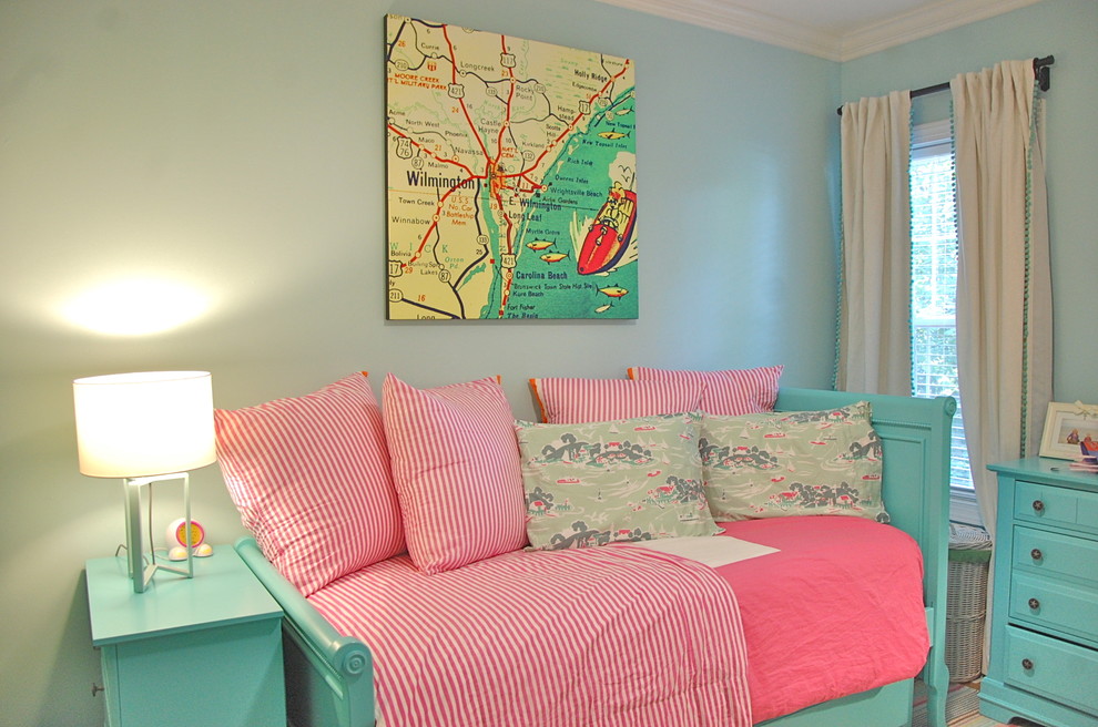 Photo of a small classic children’s room for girls in Wilmington with blue walls and light hardwood flooring.