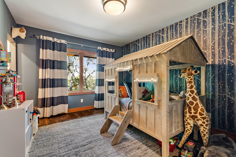 Immagine di una cameretta per bambini contemporanea con pareti blu, parquet scuro e pavimento marrone