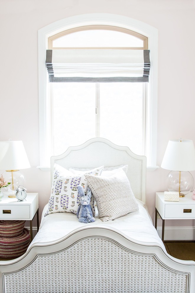 Example of a trendy girl kids' room design in Salt Lake City with pink walls