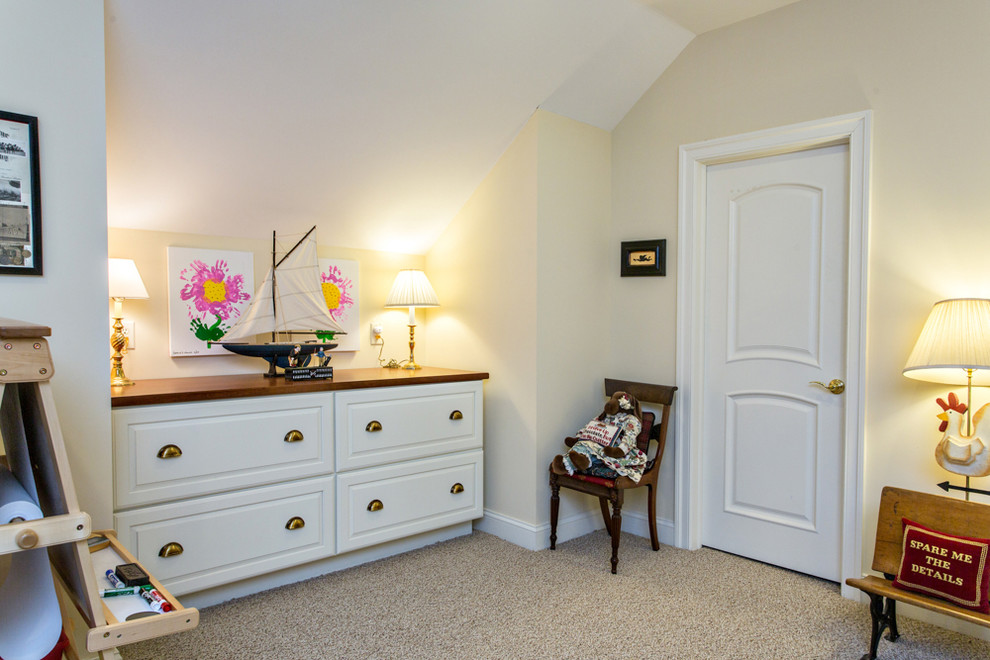 Example of a classic carpeted playroom design in Other with beige walls