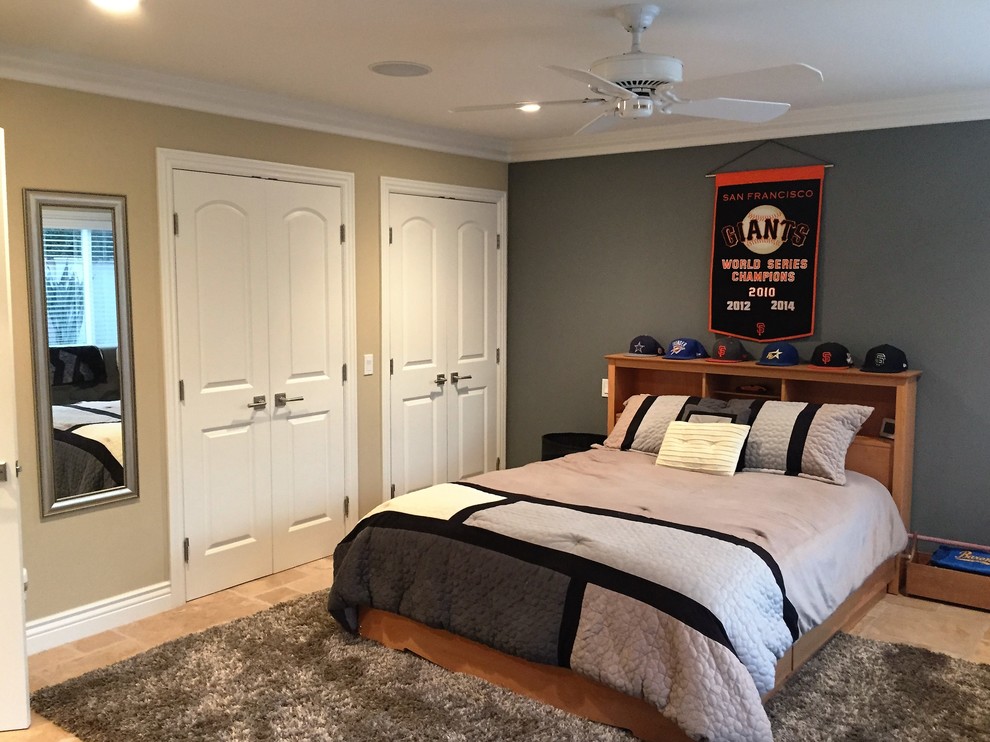 Large traditional teen’s room for boys in Orange County with travertine flooring, multi-coloured walls and brown floors.