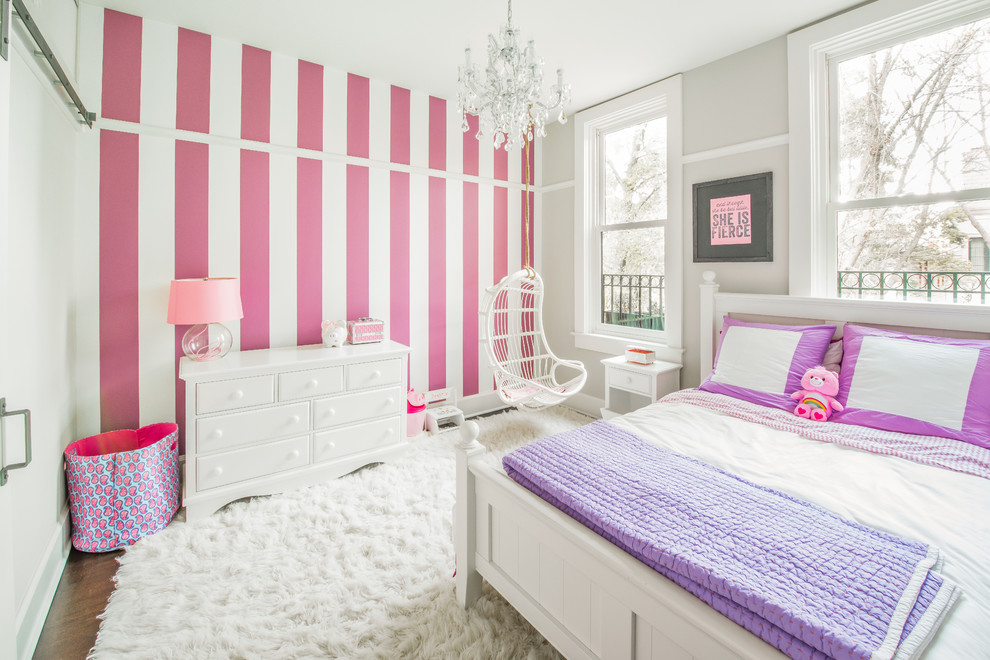 Medium sized classic children’s room for girls in Chicago with multi-coloured walls.