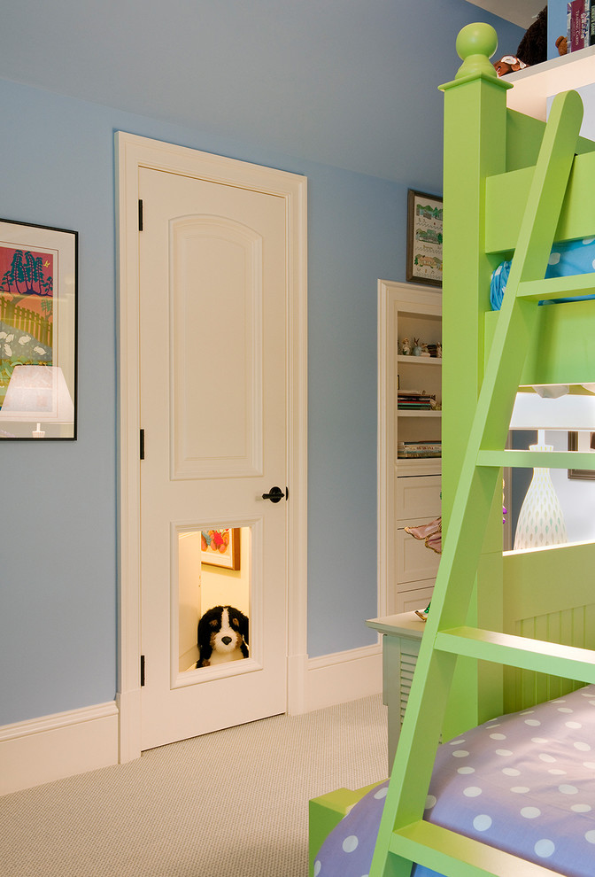 Design ideas for a traditional gender neutral children’s room in DC Metro with blue walls and carpet.