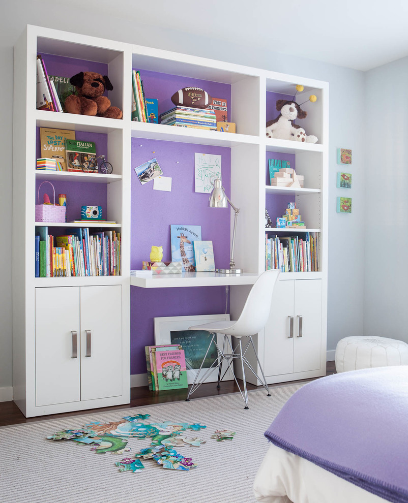 Contemporary kids' bedroom for girls in San Francisco with dark hardwood flooring.