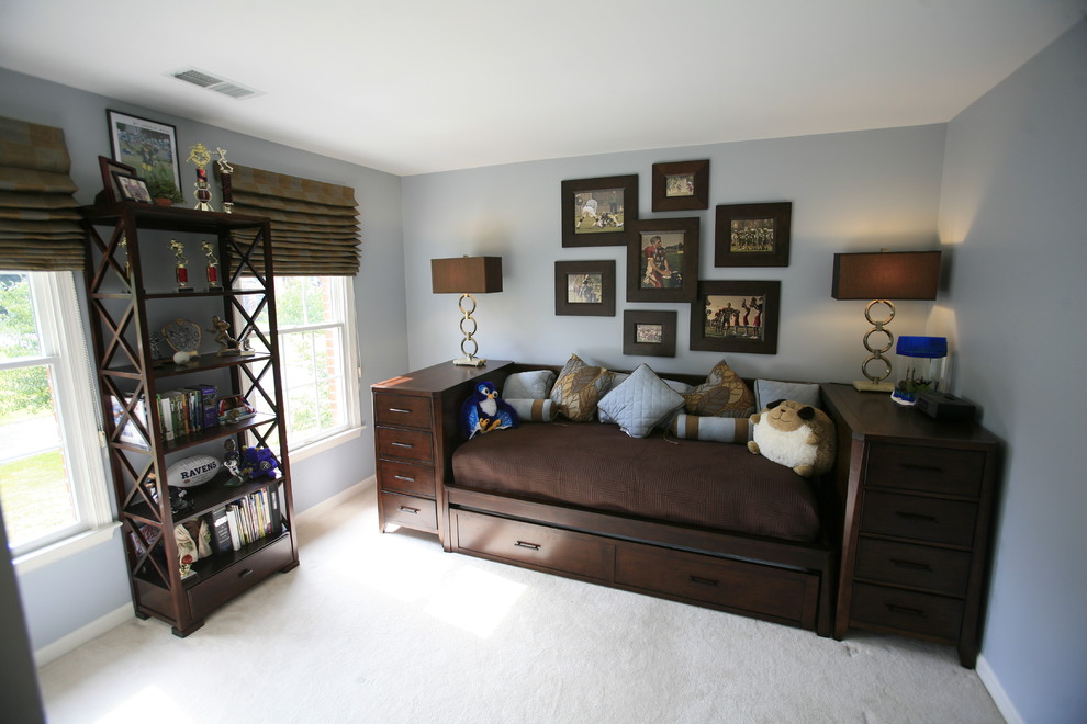 Small traditional children’s room for boys in Baltimore with blue walls, carpet and grey floors.