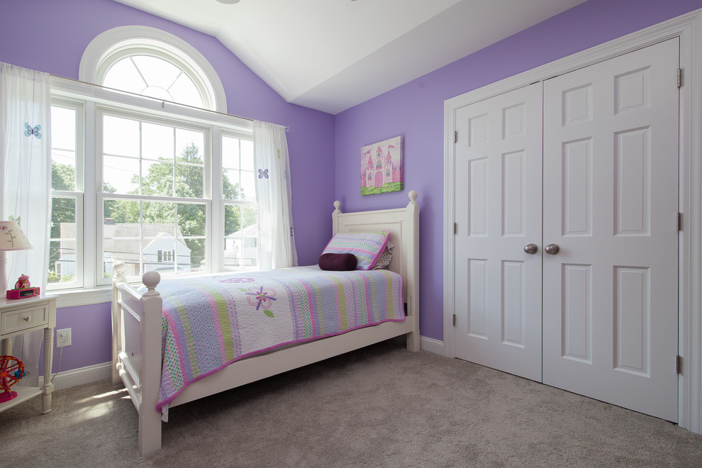 Inspiration for a classic children’s room for girls in New York with purple walls and carpet.