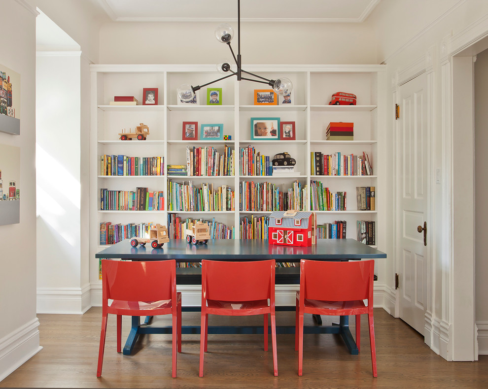Kids' room - transitional gender-neutral medium tone wood floor kids' room idea in Chicago with beige walls