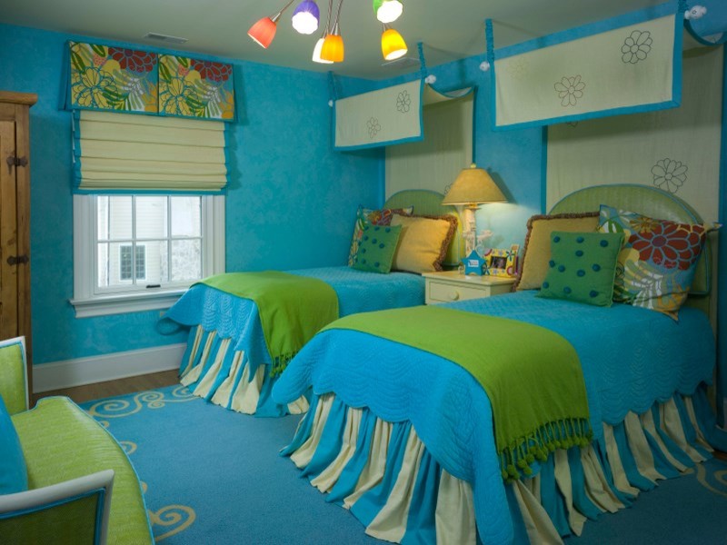 Example of a mid-sized eclectic dark wood floor and brown floor kids' room design in New York with blue walls