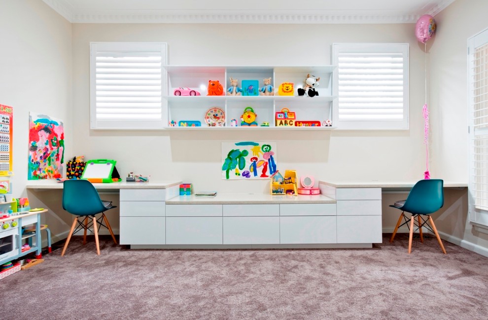 Medium sized contemporary gender neutral playroom in Melbourne with white walls and carpet.