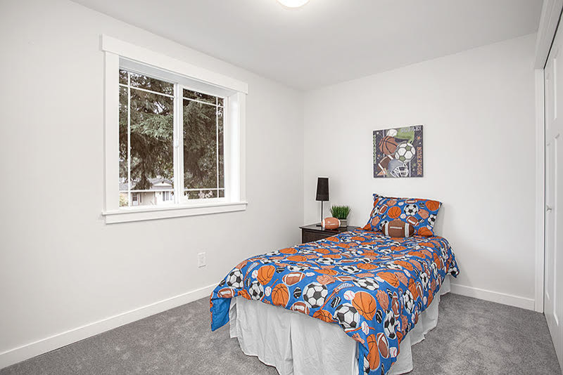 Example of a transitional boy gray floor and carpeted kids' room design in Seattle with beige walls