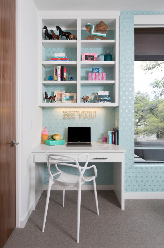 This is an example of a medium sized modern teen’s room for girls in Austin with white walls and carpet.