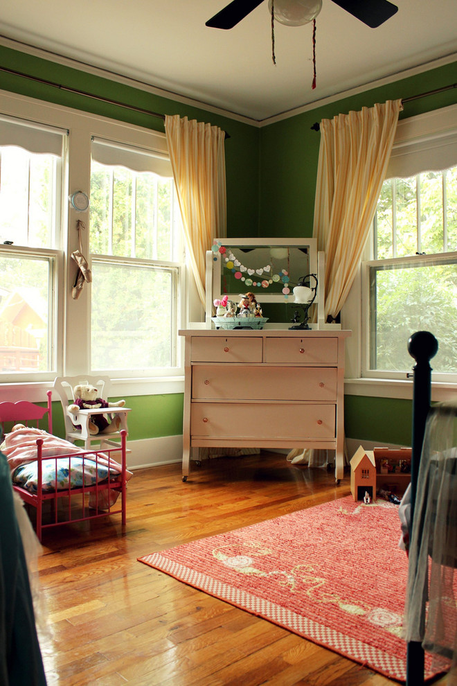 Eclectic kids' bedroom in Albuquerque with green walls.