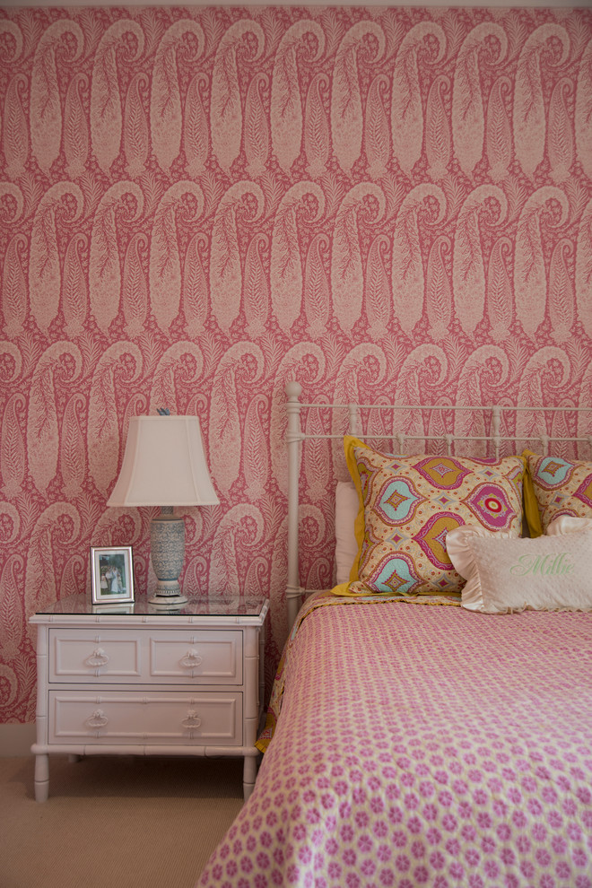 This is an example of a medium sized classic children’s room for girls in DC Metro with pink walls and carpet.