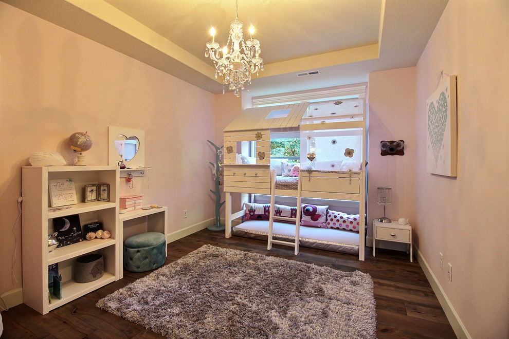 Inspiration for a huge craftsman girl medium tone wood floor and brown floor kids' room remodel in Portland with pink walls
