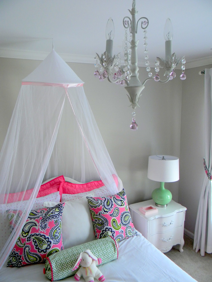 This is an example of a classic kids' bedroom for girls in Atlanta with grey walls and carpet.