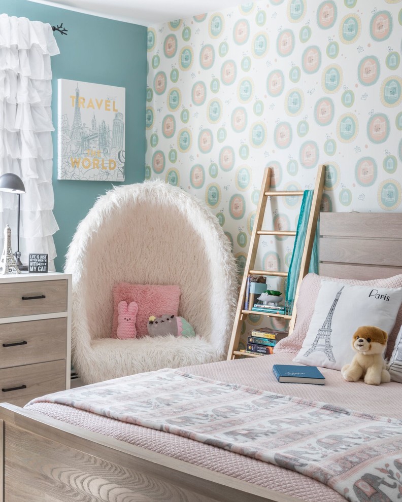 Kids' room - transitional girl kids' room idea in New York with multicolored walls