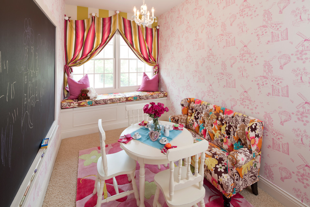 This is an example of a medium sized traditional kids' bedroom for girls in Cincinnati with pink walls and carpet.